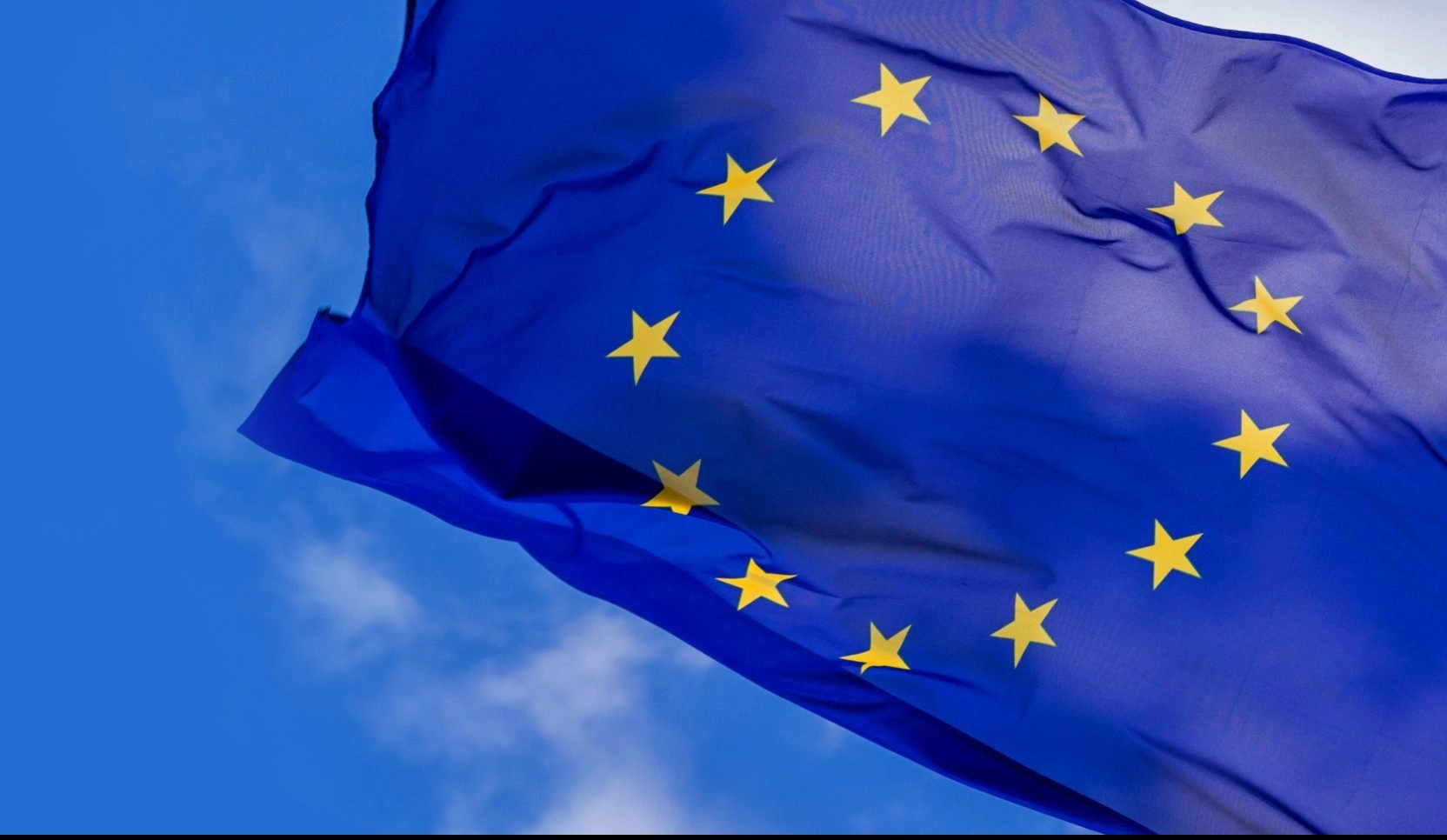 Flag of the European Union waving in the wind on flagpole
